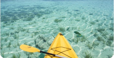 Kayak bow over clear tropical water in South Florida
